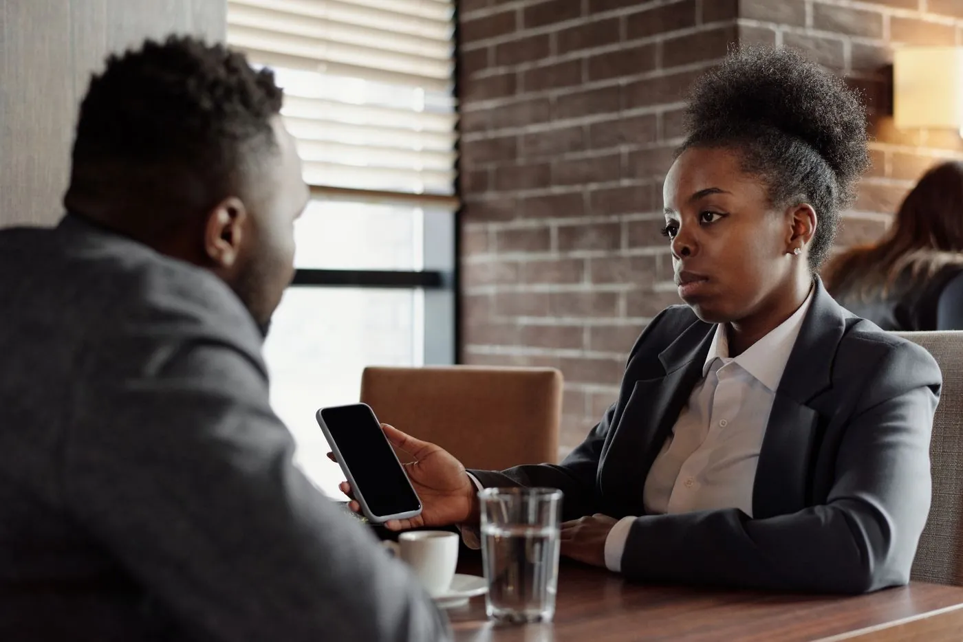 Two people discussing a question together