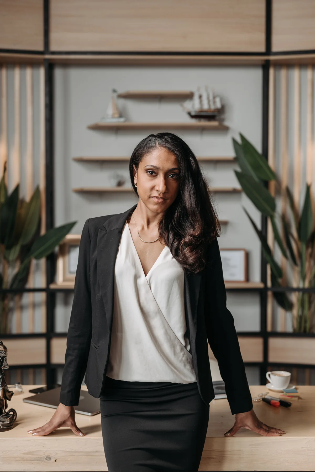 A professional in a suit in a bright office