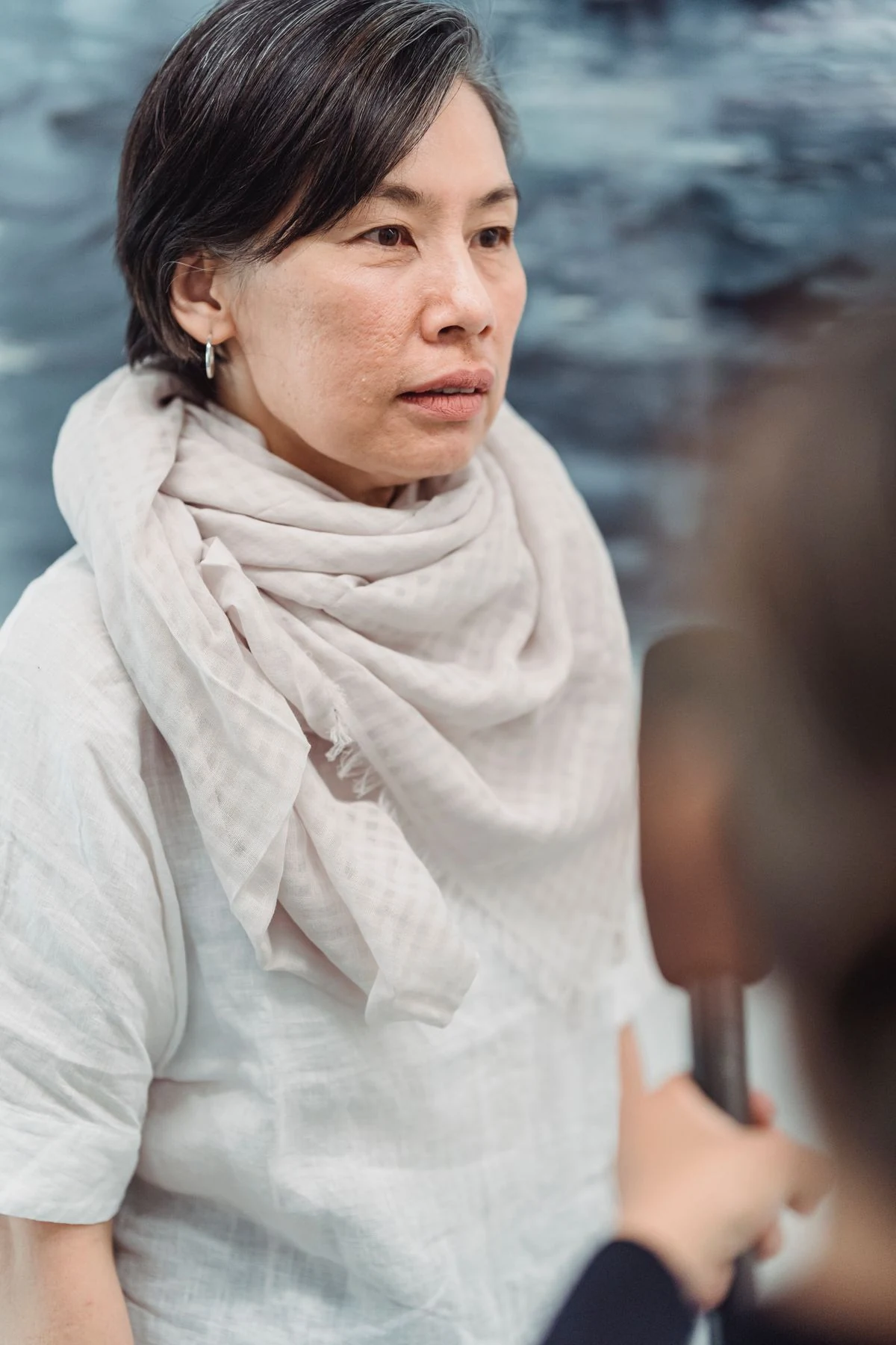 A woman listening during an interview